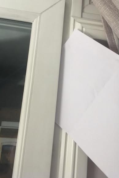 uPVC door paper test to check for tight or loose spots